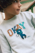 Sweatshirt - Smile light blue illustration "Okay"